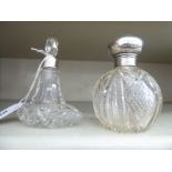 Two dissimilar glass dressing table bottles,