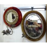 Two late Victorian girondoles, one with a decoratively bevelled oval mirror,