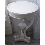 A modern cream wash painted 'antique' design torchere,