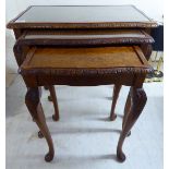 A nesting set of three burr walnut and mahogany finished occasional tables,