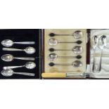 Two incomplete sets of silver coffee spoons cased;