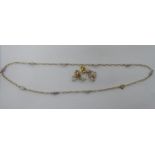 A yellow metal and freshwater pearl set necklace and a pair of matching earrings 11