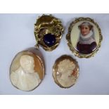 Four dissimilar 9ct gold and yellow metal variously set cameo brooches 11
