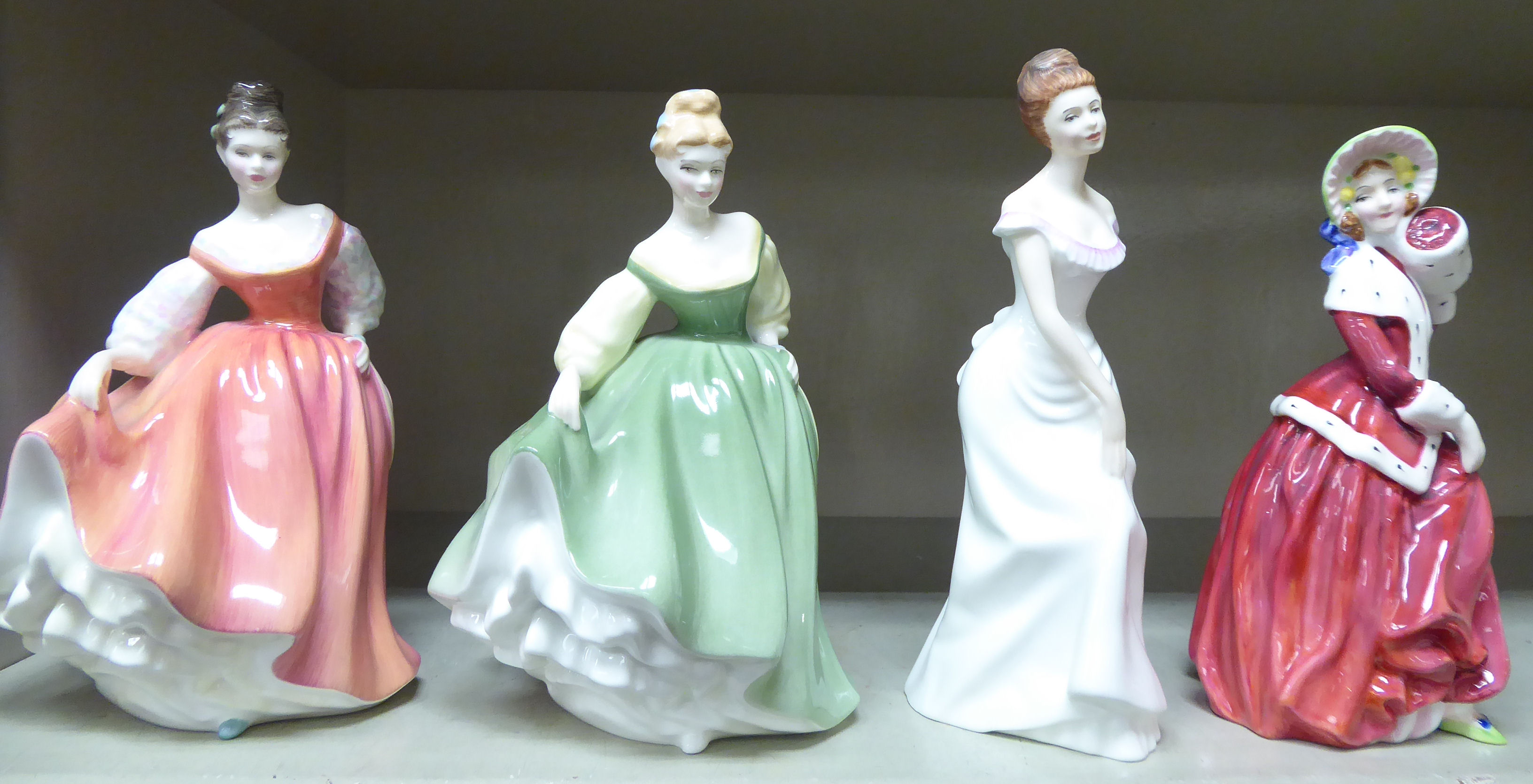 Four Royal Doulton china figures, viz.