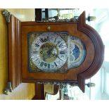 A modern Georgian inspired figured walnut cased bracket clock with gilded brass mounts,