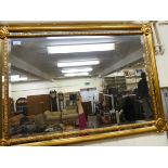 A modern mirror, the bevelled plate with border slips,