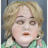 A late Victorian porcelain headed doll with fabric mobile limbs and weighted sleeping eyes 15.