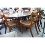 A modern Regency style dining table, the crossbanded string inlaid,