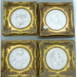 A set of four modern composition marble effect, circular plaques,