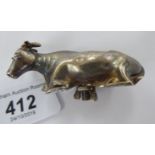 An early Victorian silver butter dish handle, fashioned as a seated cow,
