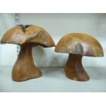 A pair of polished, turned hardwood one-piece,