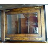 A late Victorian string inlaid walnut pier cabinet with a glazed door, enclosing two shelves,