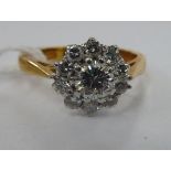 An 18ct gold claw set diamond cluster ring 11