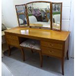 A modern string inlaid crossbanded, satin mahogany finished, four drawer kneehole dressing table,