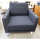 A charcoal coloured fabric upholstered office reception easy chair, raised on chromium plated,