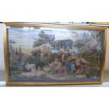 A 20thC tapestry picture of young men and women in a landscape,