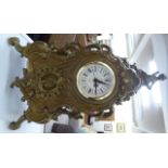 A modern rococo inspired gilt metal mantel timepiece with a quartz movement 9''h OS10