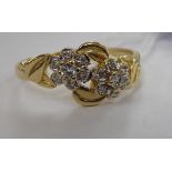 A 14ct gold and diamond set, crossover style,