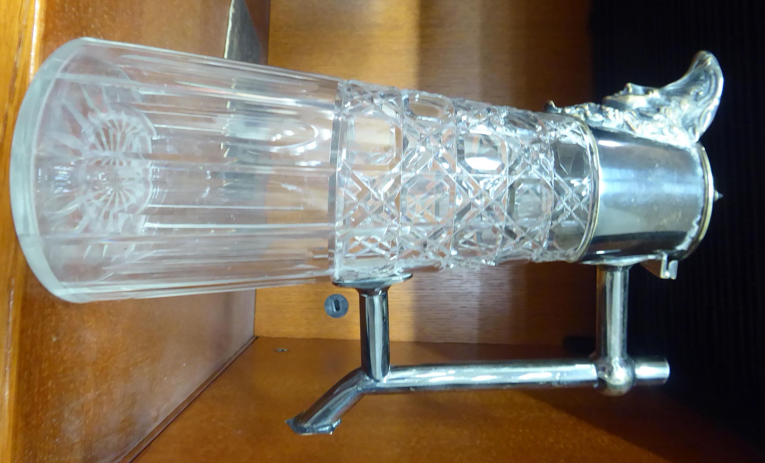 An early 20thC slice cut glass claret jug of tapered form,