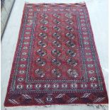 A Bokhara rug, decorated with traditional designs,