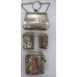 Three early 20thC silver vesta cases, two variously decorated with scrolled ornament; and a silver,