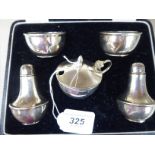 A five piece silver condiments set, comprising a pair of vase design pepper pots,