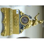 A late 19thC French patinated and parcel gilt bronze cased mantel clock,
