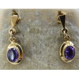 A pair of yellow metal backed amethyst set pendant earrings 11