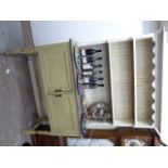 A 1920s later washed, cream coloured, painted cottage dresser with a shelved,
