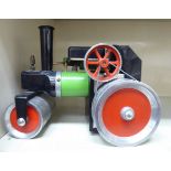 A Mamod green and red painted live steam model road roller OS6