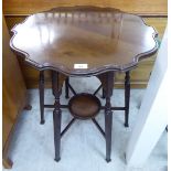 A 1930s mahogany occasional table, the thumb moulded piecrust top raised on block, tapered legs,
