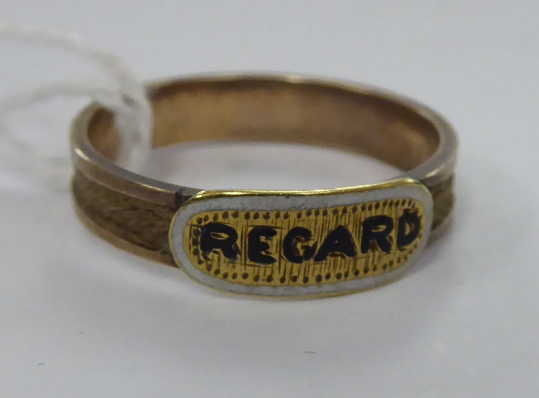 An early Victorian yellow metal and enamel 'Regard' ring 11