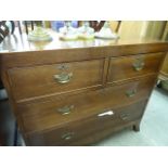An early 20thC crossbanded mahogany four drawer dressing chest,