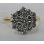 An 18ct gold claw set diamond cluster ring 11