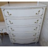 A modern French inspired cream coloured painted and gilded five drawer dressing chest,