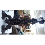 A modern cast and patinated parcel gilt table lamp, fashioned as three cherubic figures,