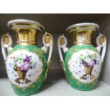 A pair of late 19th/early 20thC Continental porcelain ovoid shaped twin handled vases,