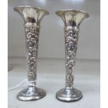 A pair of small Edwardian silver specimen vases,