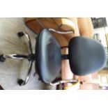A modern black hide upholstered office swivel chair,