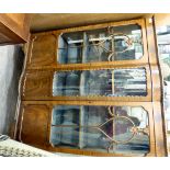 A 1930s mahogany display cabinet with pair of glazed doors, enclosing three shelves,