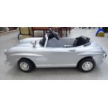A child's battery powered convertible Mercedes toy car in silver livery CB