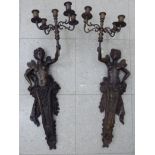 A pair of modern patinated bronze effect appliques, each fashioned as a fairy term figure,