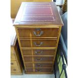 A modern yewwood three drawer filing cabinet, on a plinth 39''h 19.