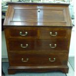 An Edwardian mahogany bureau with a fall flap, over two short/two long drawers,