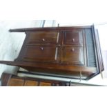 A 1930s freestanding Maxitone gramophone, the panelled mahogany cabinet with a rising top,