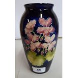 A Moorcroft midnight blue glazed pottery vase of baluster form,
