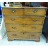 A George III oak dressing chest with two short/three long drawers,