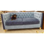 A Greengate two person box settee with a high, level back and elevated arms,