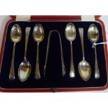 A set of six silver Old English pattern coffee spoons with matching sugar tongs Sheffield 1915