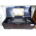 A late 19thC Swiss made black lacquered, walnut finished and marquetry music box,